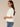 Off White Smock Short Sleeve Ruffle Shoulder Detail Round Neck Miced Media Woven Knit Top