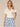Off White Extended Drop Shoulder Banded Sleeve Printed Pocket Collared V-Placket Knit Top
