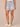 Light Blue Artisanal Denim Absolution High Rise Roll Cuff Spade Back Pocket Distress Whiskering Short