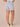 Light Blue Artisanal Denim Absolution High Rise Roll Cuff Spade Back Pocket Distress Whiskering Short